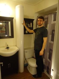 Designer Derek standing next to his baby!